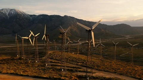 Aerial view of a windmill farm at sunset Stock Footage 105763147