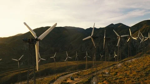 Aerial view of a windmill farm at sunset Stock Footage 105763148