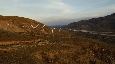 Aerial view of a windmill farm at sunset Stock Footage 105763410