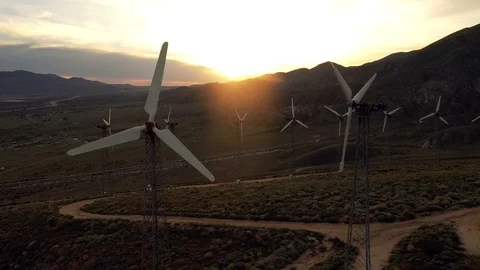 Aerial view of a windmill farm at sunset Stock Footage 105763641