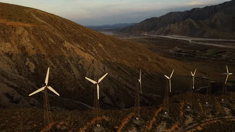 Aerial view of a windmill farm at sunset Stock Footage 105763727