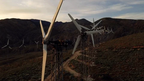 Aerial view of a windmill farm at sunset Stock Footage 105763792