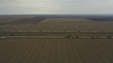 Aerial view Windmill power generator in dry field in Crimean peninsula Video stock 118742625