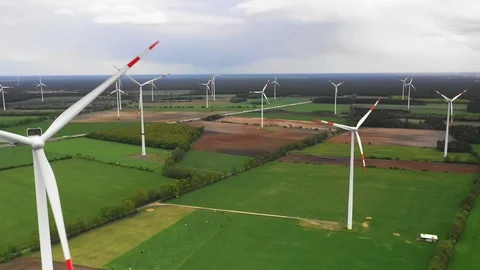 Aerial view of windmill power stations turbines on field Stock Footage 107582958
