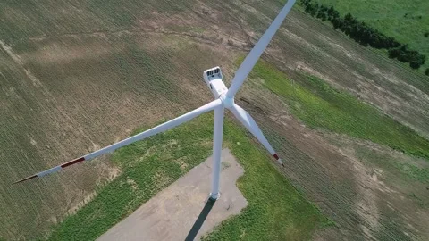 Aerial view of windmills farm in the fields. World energy power crisis. Green Stock Footage 223531085