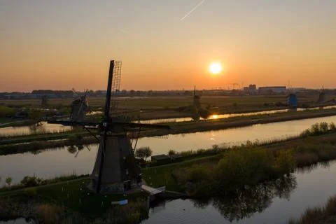 Aerial view of windmills in the Kinderdijk area during sunset. Spring in Holland Stock Photos