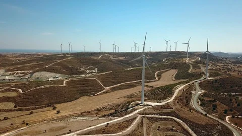 Aerial view of windmills in the mountains, In the background the sea 스톡 동영상 89947502