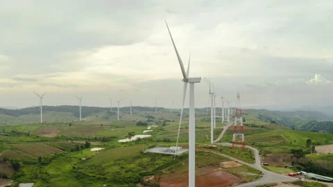 Aerial view, windmills rotating on cloudy sky at highland. The look up shot Stock Footage 202221678