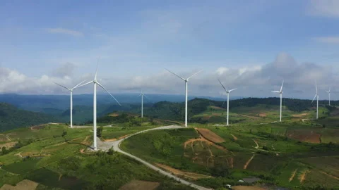 Aerial view of windmills rotating by the force of the wind Stock Footage 199344979