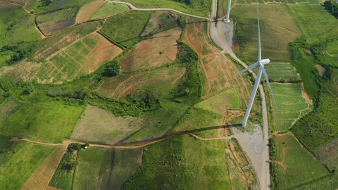 Aerial view of windmills rotating by the force of the wind Stock Footage 199345542