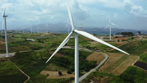 Aerial view, windmills rotating by the wind on cloudy sky at highland. Video stock 171943062