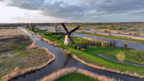 Aerial View to the windmills at sunset in the Netherlands village of Kinderdijk Stock Footage 270653376