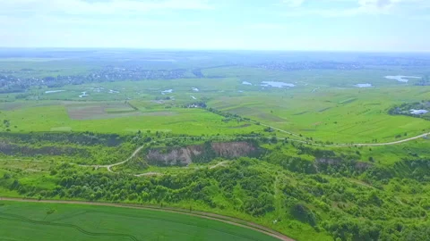 Aerial view from the window of the plane to the green fields and groves. Ukraine Stock Footage 150657029