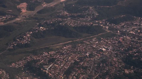 Aerial view from window of plane of semi-urban housing and highway on edges of 스톡 동영상 101301592