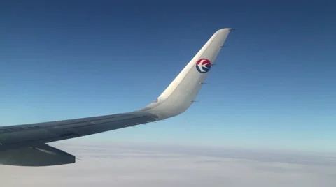 Aerial View with the Wing of China Eastern Airline's Plane. HD Stock-Footage 49481998