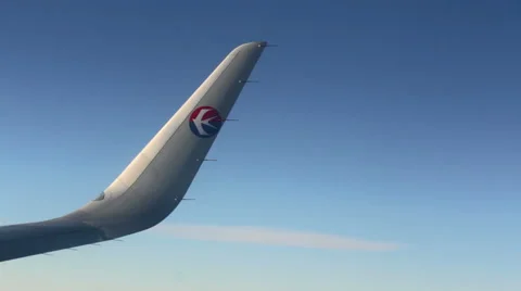 Aerial View with the Wing of China Eastern Airline's Plane. HD Stock Footage 49482324