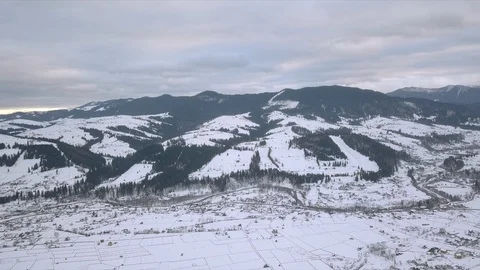 Aerial view of winter forest mountains Stock Footage 125456010