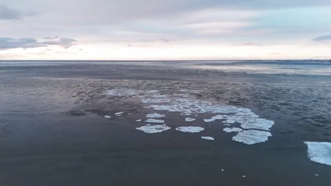 Aerial view of winter ice sheets on cold water surface, Iceland Stock Footage 337612538
