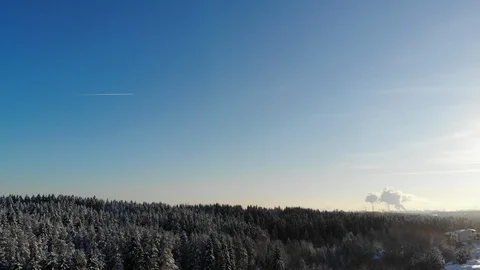 Aerial view of winter landscape with blue sky captured from above with a drone Stock Footage 101735291