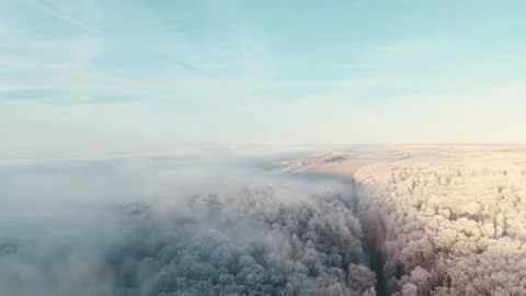 Aerial View Of Winter Landscape During Sunrise and Think Clouds Video stock 325303539