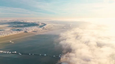 Aerial View Of Winter Landscape During Sunrise and Think Clouds Video stock 325303624