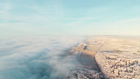 Aerial View Of Winter Landscape During Sunrise and Think Clouds Video stock 325303876