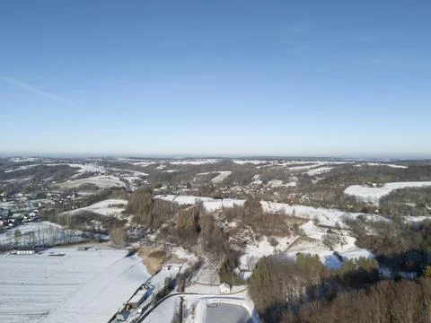 Aerial view of a winter landscape showcasing a serene countryside covered in Stock Photos