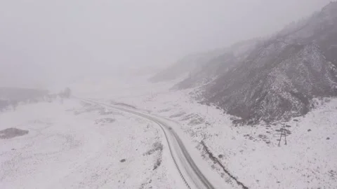 Aerial view of winter road during the foggy weather 스톡 동영상 237394432