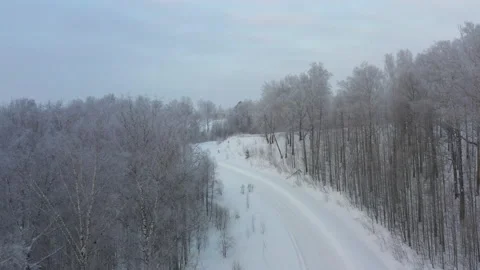 Aerial view of a winter road in the forest 12 Stockbeeldmateriaal 134852995