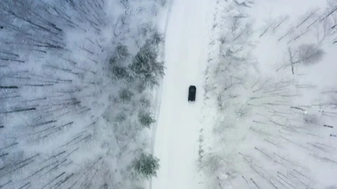 Aerial view winter road through the forest 6 Stock Footage 134854371