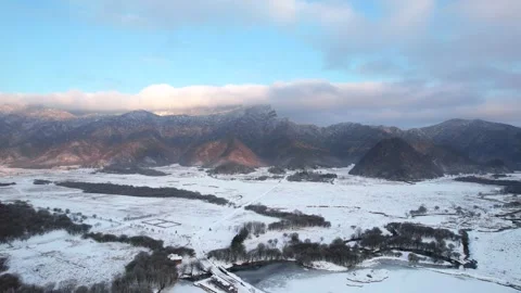 Aerial View of Winter Snow Valley Village Wide Wetland in Shennongjia Hubei Stock Footage 337941179