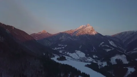 Aerial view of winter sunset over alpine mountains Stock Footage 88166820