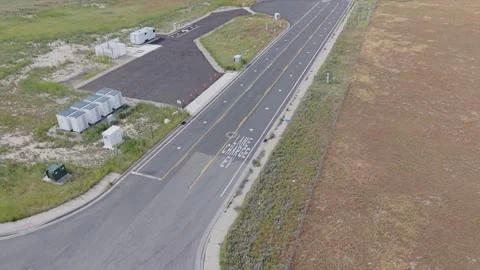 Aerial view of a wireless electric vehicle charging road in Utah Stock Footage 340237828