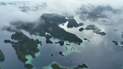 Aerial View of Wispy Clouds and Beautiful Rock Islands in Raja Ampat Stock-Footage 308129588