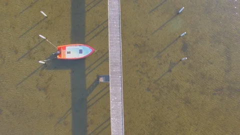 Aerial view of a Wooden pier with attached boats Stock Footage 91493953