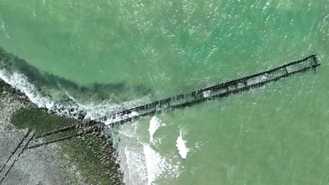 Aerial View of a Wooden Wave Breakwater on the North Sea Coast Stock Footage 344655152