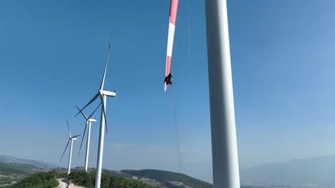Aerial view of worker working at wind power plant Stock Footage 294949210