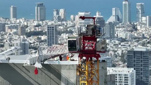 Aerial view of workers and cranes at a construction site Stock Footage 228111829
