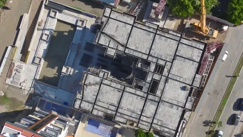 Aerial View: Workers and engineers install a crane with precision and teamwork Stock Footage 296018203