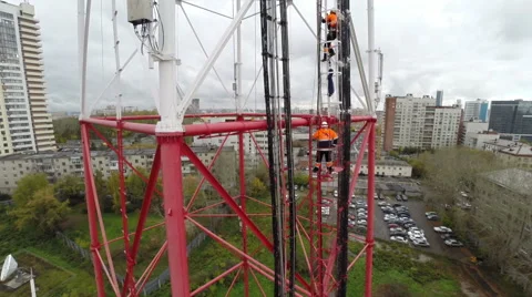 Aerial view. workers climb the TV tower Stock Footage 59597196