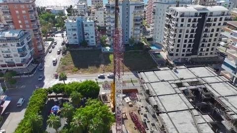 Aerial View: Workers handle crane components efficiently while engineers Video stock 296020726