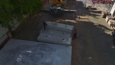 Aerial View: Workers handle large crane sections with heavy equipment while Stock Footage 296098779