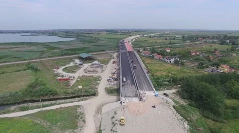 Aerial view on workers with heavy machines working on bridge reconstruction Stock Footage 65169964