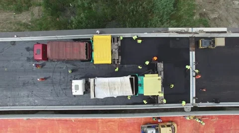 Aerial view on workers with heavy machines working on bridge reconstruction Stock Footage 65170652