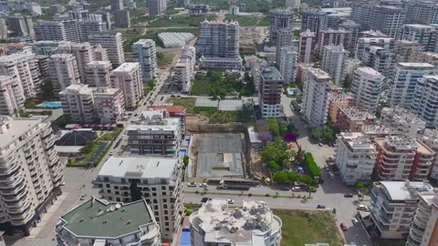 Aerial View: Workers insulate building foundations and install metal structures Stock Footage 296096943