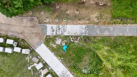 Aerial View of Workers Laying Pavement Tiles Stock Footage 300332795