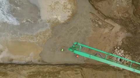 Aerial View: Workers pour concrete for the foundation of a new project, as Stock Footage 296084891
