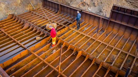 Aerial view on workers as they manually cutting old ship with blowtorch, mi.. Stock Photos