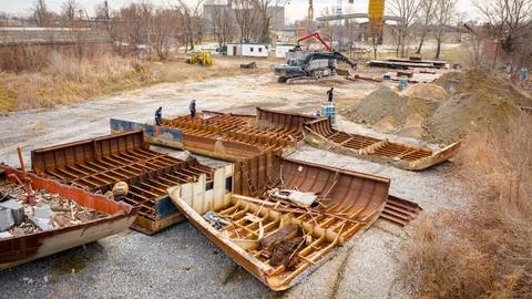 Aerial view on workers as they manually cutting old ship with blowtorch, mi.. Stock Photos