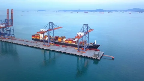 Aerial view, working crane bridge is unloading container to large vessel. Stock Footage 123140968